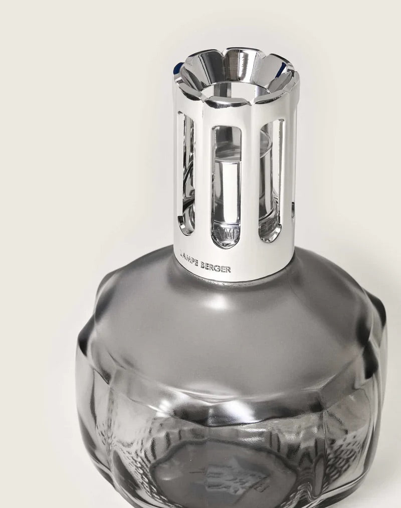 Close-up of the gray Lampe Berger Molecule lamp's faceted glass and silver top