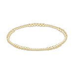 Gold beaded stretch bracelet with varying bead sizes