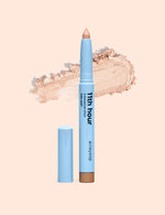Light blue eyeshadow stick with a pearl shimmer swatch behind it