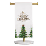 White tea towel with Merry Christmas text and decorated Christmas tree print on a gold and marble stand