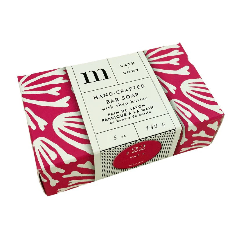 Hand crafted bar soap with shea butter in pink and white floral patterned packaging