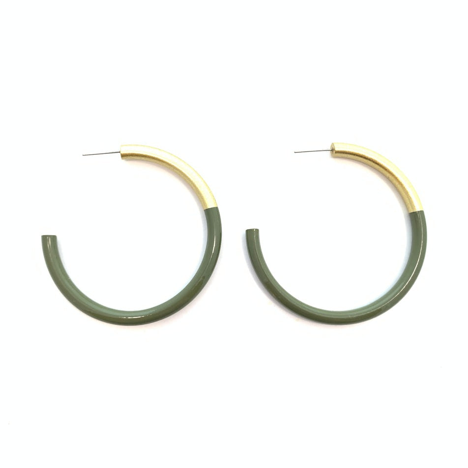 A pair of green and gold lacquered hoop earrings. 