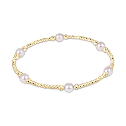 Gold beaded stretch bracelet with evenly spaced white pearls