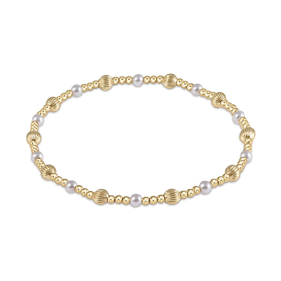 Gold beaded bracelet with alternating pearl accents and ribbed gold beads