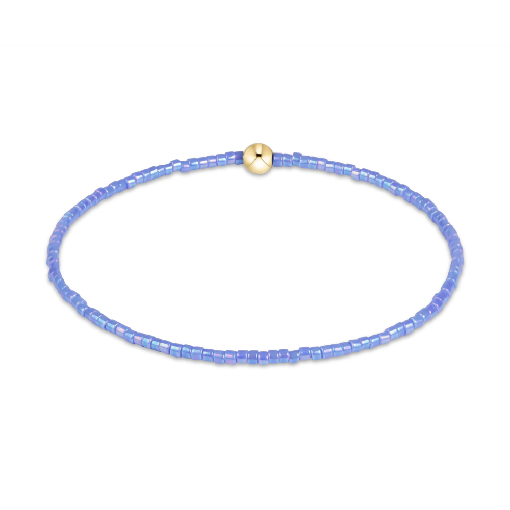 Periwinkle seed bead stretch bracelet with a single gold bead