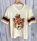 Vintage LSU Tigers jersey on a wooden background
