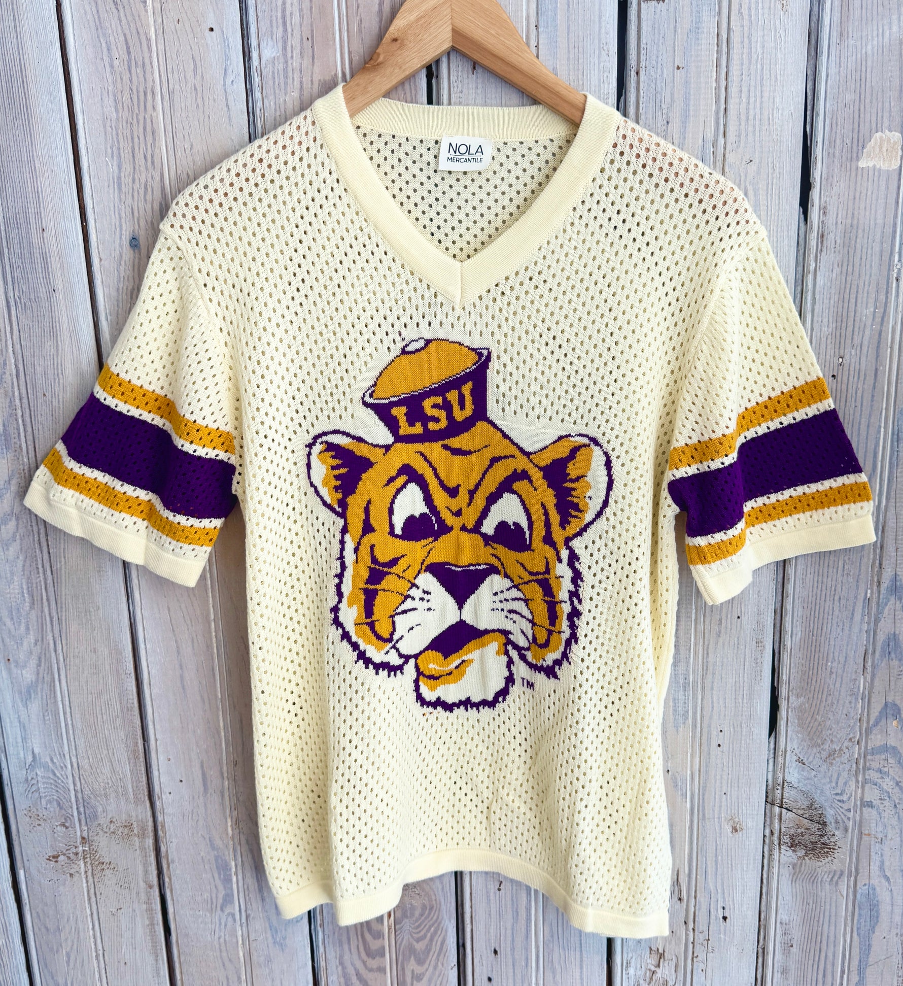 Vintage LSU Tigers jersey on a wooden background