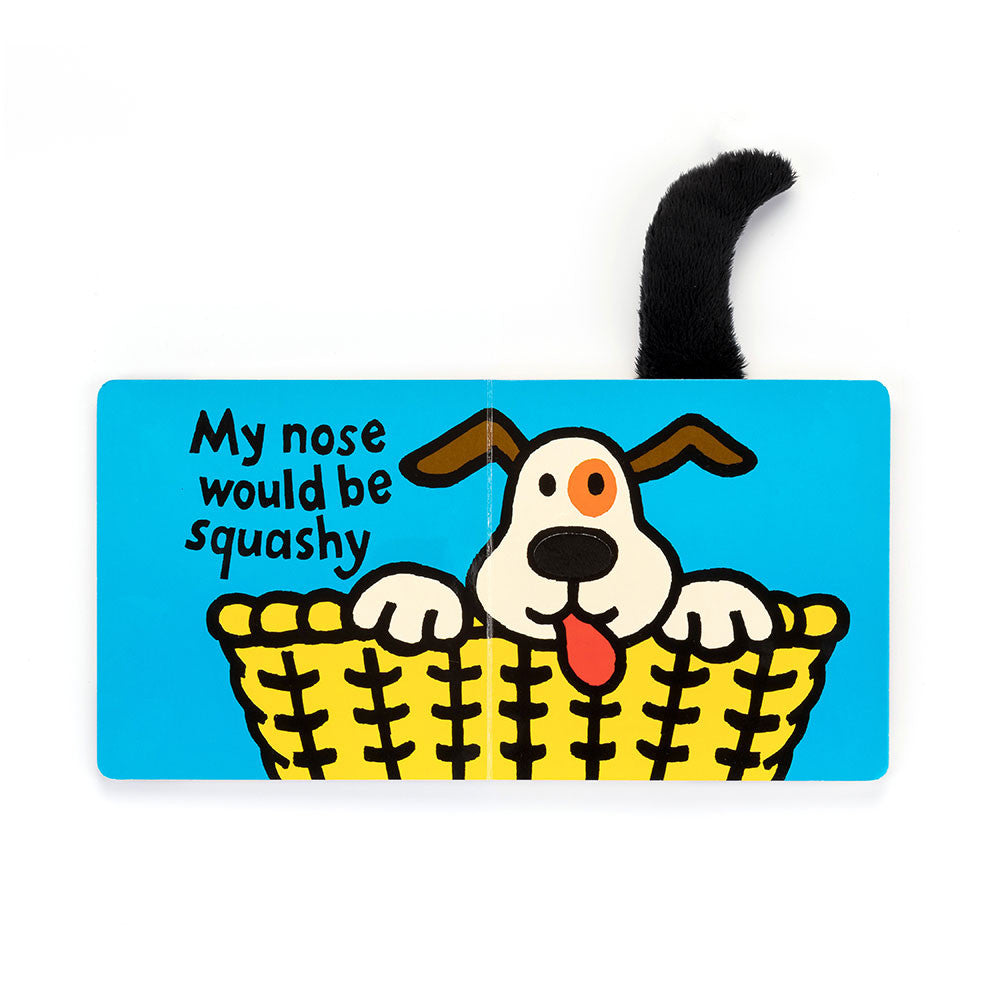Illustration of a dog in a yellow basket with a plush black tail attached to the book page