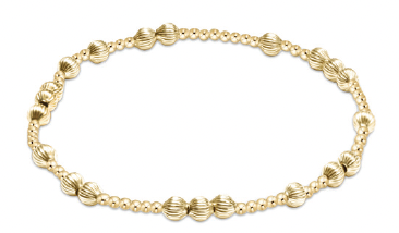 Gold beaded stretch bracelet with alternating smooth and ribbed round beads