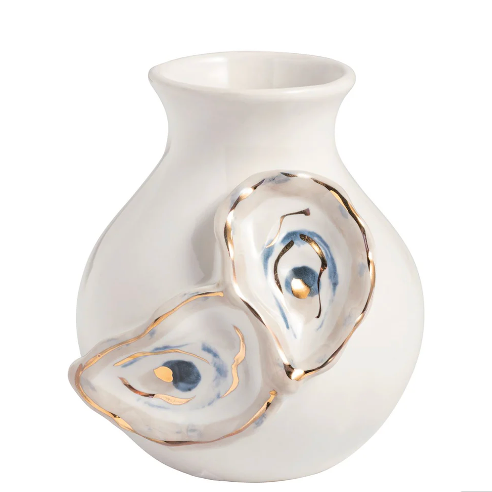 White vase with abstract designs on a white background