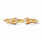 Gold cuff bracelet with two faceted white stones at the opening