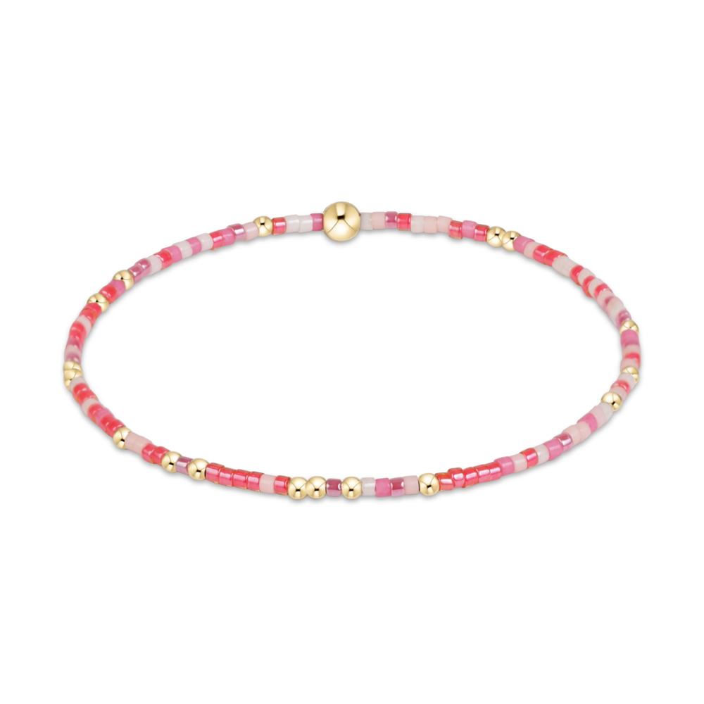 Pink and red mixed seed bead stretch bracelet with gold accents