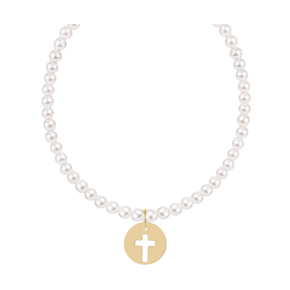 Pearl necklace with a gold circular pendant featuring a cutout cross