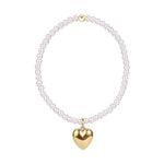 Pearl beaded bracelet with a gold heart charm and a single gold bead