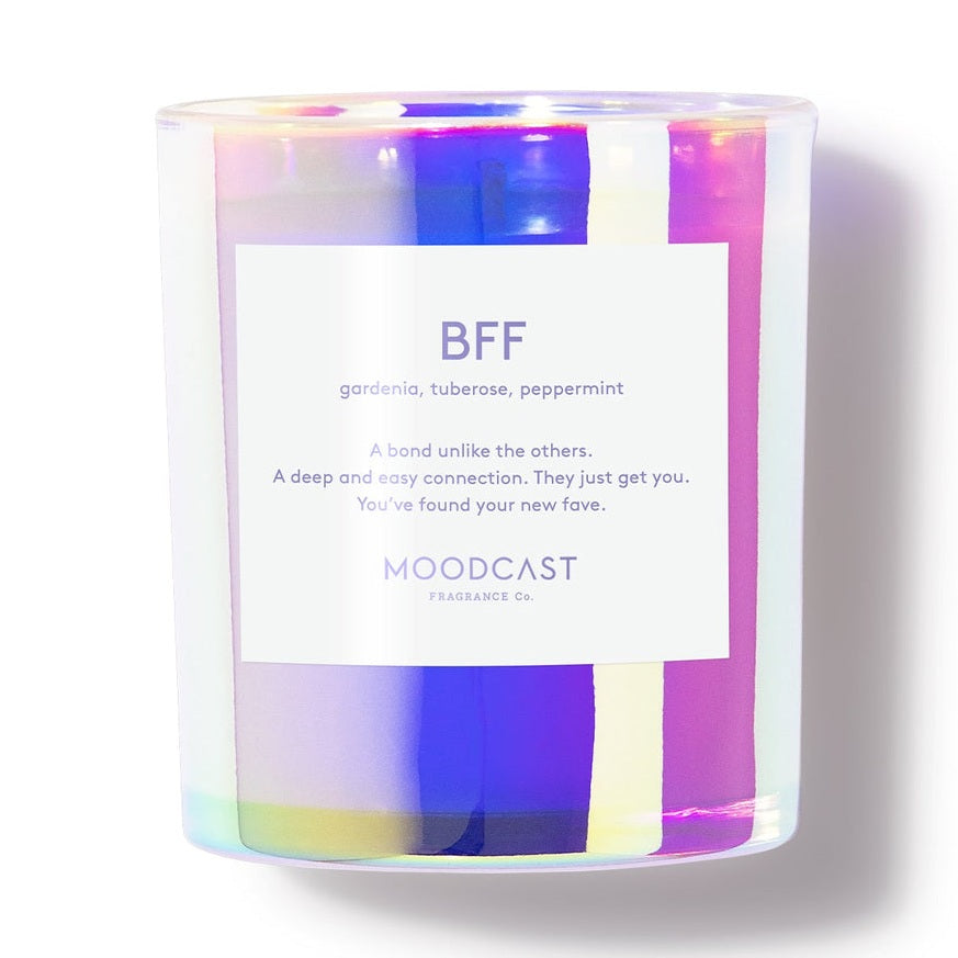 Iridescent glass candle jar with a white label reading BFF gardenia tuberose peppermint Moodcast Fragrance Co