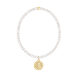 White pearl beaded necklace with a gold Saint Christopher pendant