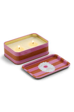 Paddywax Orange Blossom soy wax candle in a rectangular pink and orange striped tin container with two lit wicks and its separate lid featuring the product label