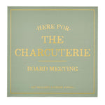 Sage green gift box with gold foil lettering stating HERE FOR. THE CHARCUTERIE BOARD MEETING and SET INCLUDES 3 CHEESE KNIVES framed by a gold border