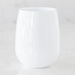 Opaque white stemless wine glass featuring a glossy finish with subtle light reflections on a minimal marble surface