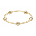 Gold beaded stretch bracelet with four larger ribbed accent beads