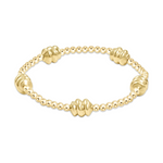 Gold beaded stretch bracelet with five larger ribbed accent beads