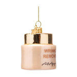 Glass ornament shaped like a pale peach anti-aging cream jar with glittery gold WRINKLE REMOVE Anti-Aging text, a shiny gold lid, and a hanging gold star charm