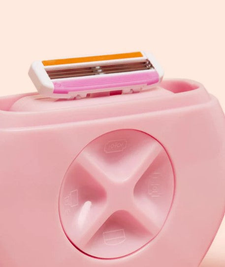 Pink razor handle with a multi blade cartridge attached