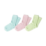Three pairs of soft fuzzy ankle socks in pastel light blue, pink, and light green