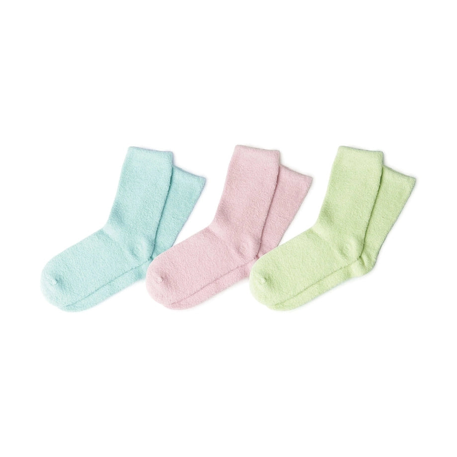 Three pairs of soft fuzzy ankle socks in pastel light blue, pink, and light green