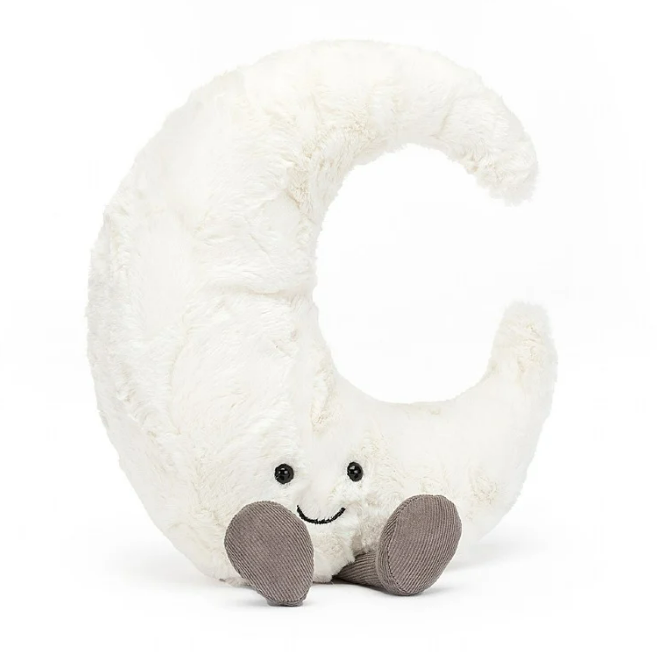 White crescent moon plush toy with grey corduroy feet and embroidered face