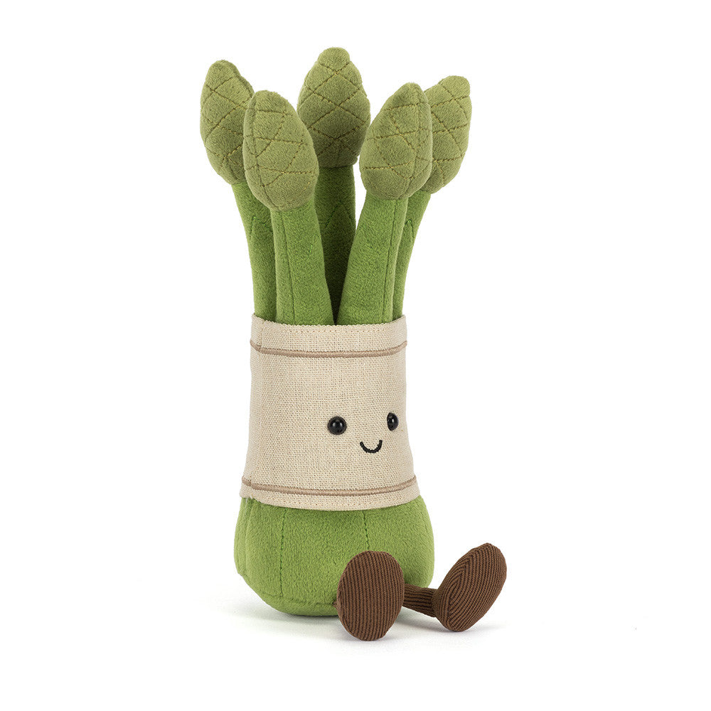 Plush asparagus toy with a beige band and small brown feet