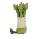 Plush asparagus bundle toy with small brown feet and a beige fabric band