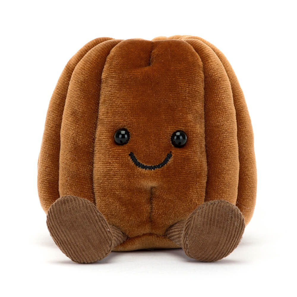 Plush toy featuring a squat ribbed brown body with corduroy feet glossy black eyes and an embroidered black smile on a white background