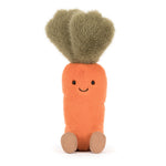 Jellycat plush toy of a fuzzy orange carrot character with fluffy green leaves and a sweet stitched smile on a white background