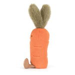 Plush toy: A cheerful soft orange carrot character with fluffy green leaf hair, a tiny black stitched eye, and a small brown corduroy foot resting on a white background