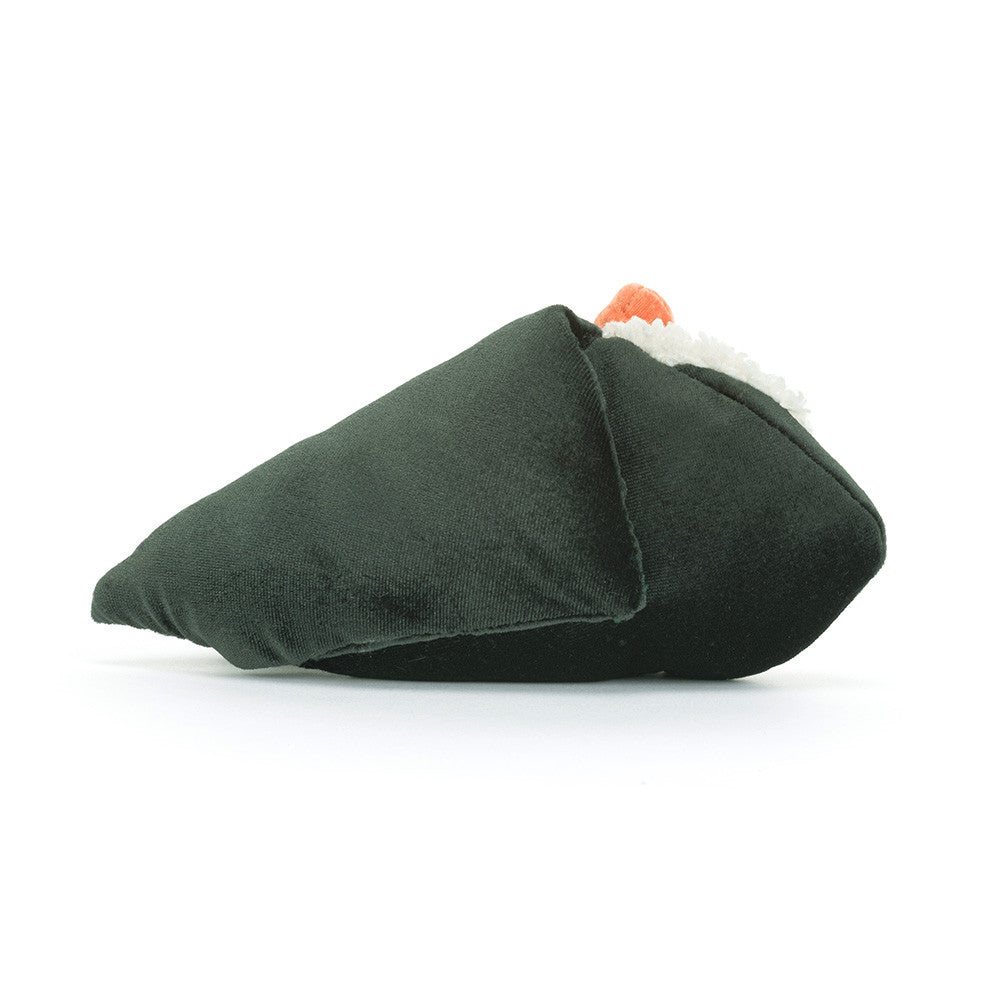 Soft plush toy by Jellycat depicting a hand-rolled temaki sushi on a white background featuring a dark forest green velvet nori wrap, textured white fleece rice, and a vibrant orange topping