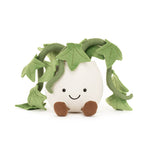 Plush toy white potted plant with green ivy-like leaves, an embroidered smiling face, and small brown corduroy feet on a plain white background