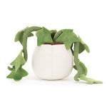 Plush toy featuring a vibrant green houseplant with dangling vines and heart-shaped leaves in a creamy white fabric pot with brown felt soil against a clean white background