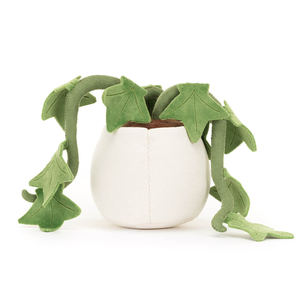Plush toy featuring a vibrant green houseplant with dangling vines and heart-shaped leaves in a creamy white fabric pot with brown felt soil against a clean white background