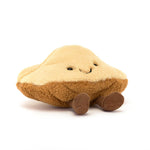 Plush toy shaped like a piece of toast with a smiling face and corduroy legs