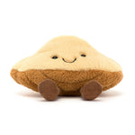 Plush toy shaped like a mushroom cap with a smiling face and small brown corduroy feet