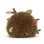 Round brown plush toy with fabric leaves and twigs
