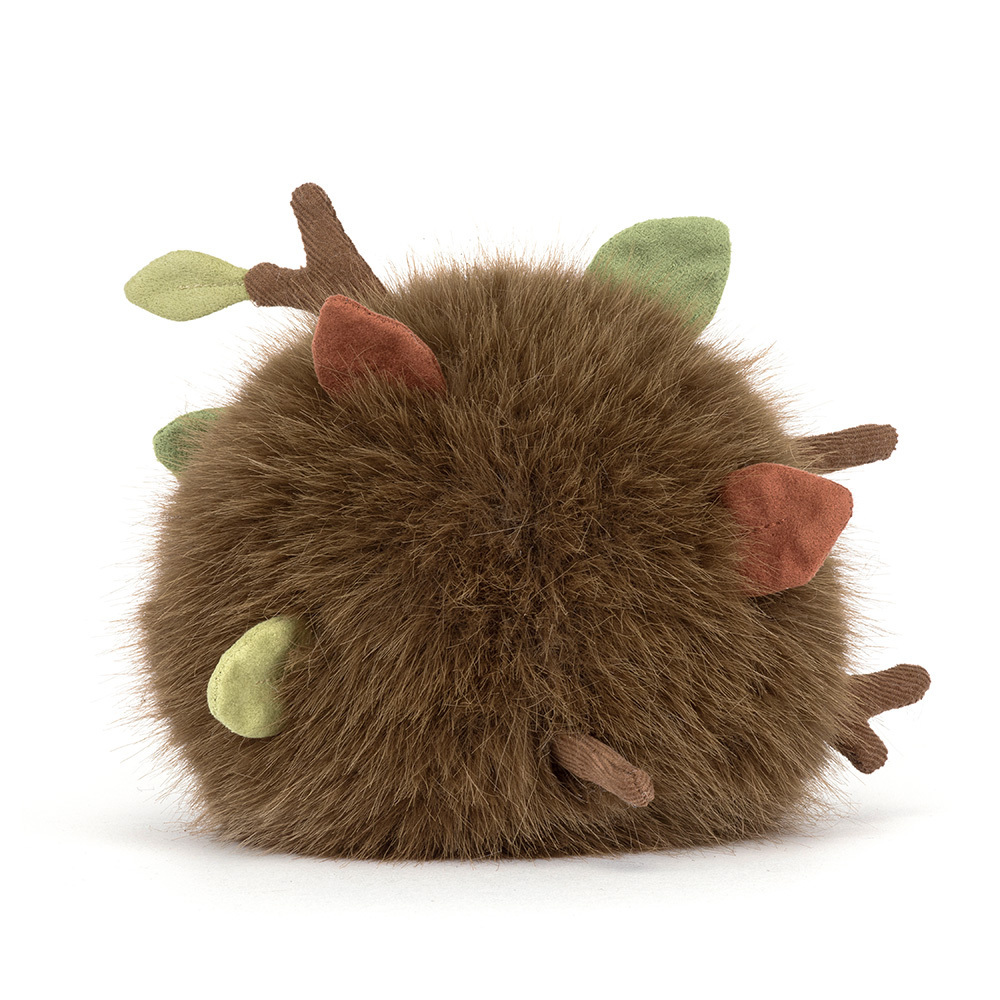 Round brown plush toy with fabric leaves and twigs