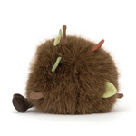 Round brown plush toy with small green leaves and brown twigs