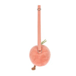 A plush light orange peach-shaped bag featuring a fuzzy texture, green fabric leaves, small brown feet, and an adjustable pink strap on a white background