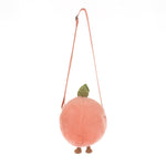A plush novelty bag in a fluffy peachy-pink round design featuring a green leaf accent tiny brown feet and a thin pink shoulder strap