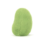 Plush toy by Jellycat of a lime green bean-shaped figure on a white studio background featuring soft fuzzy texture and a rounded organic silhouette