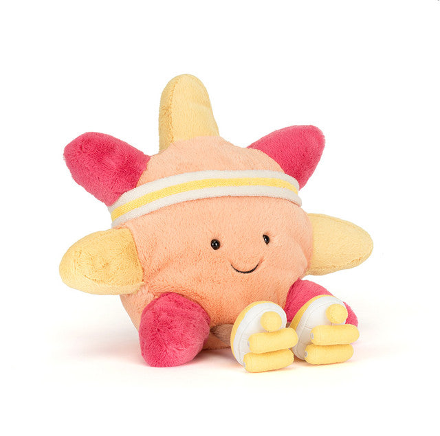 Plush star toy wearing a headband and sneakers