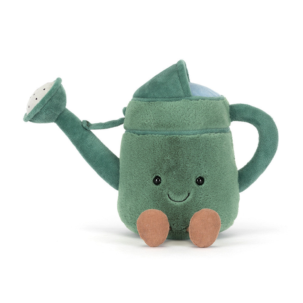 Photograph of a Jellycat Vivacious Watering Can plush toy sitting on a white background, featuring a muted green body, a light blue interior brim, an embroidered smiling face with black eyes, and two small brown corduroy feet
