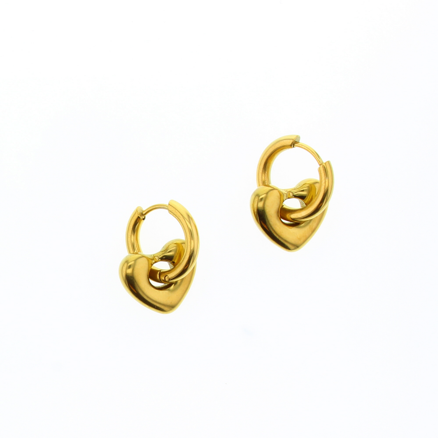 Jewelry photograph of small gold hoop earrings featuring chunky abstract heart-shaped charms with a polished metallic finish and rounded edges set against a white background